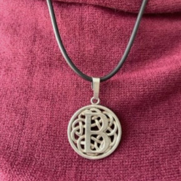 Reversible silver intial pendant with rubber cord. - Picture 1 of 3